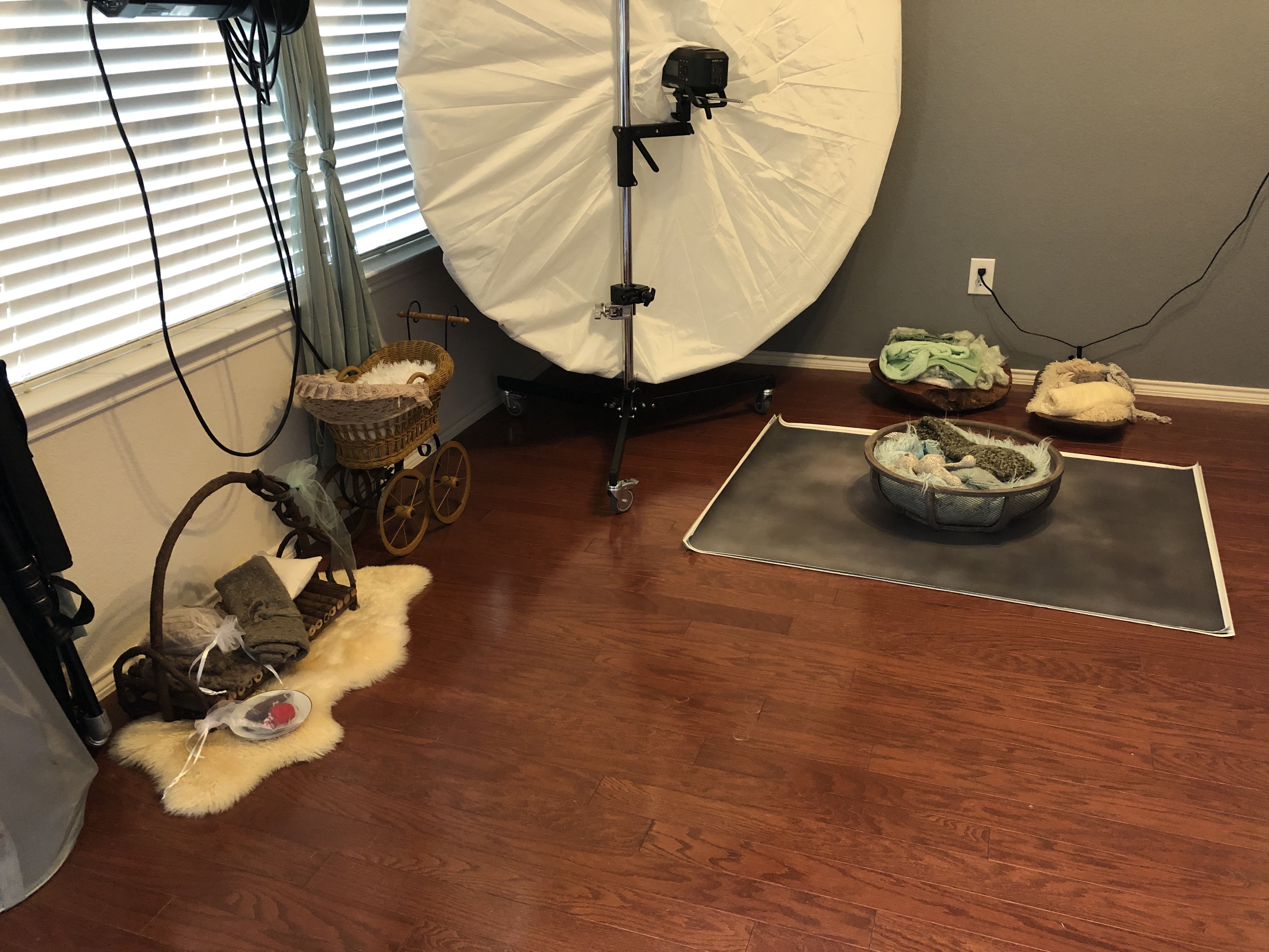 Corner of the home studio with the sets laid out and ready for a newborn session