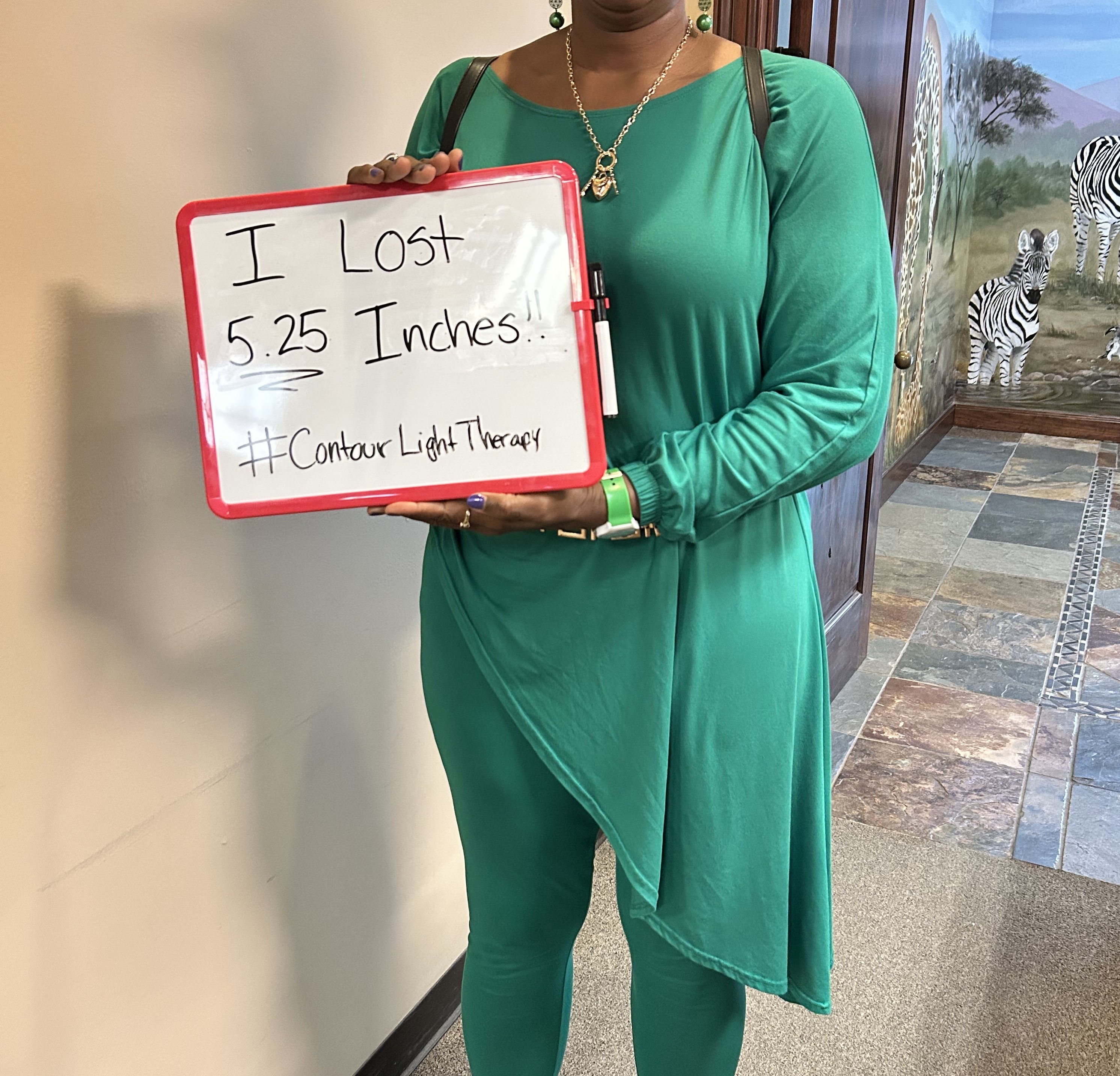 Woman holding a sign saying "I lost 5.25 inches" Woman holding a sign saying "I lost 5.25 inches"