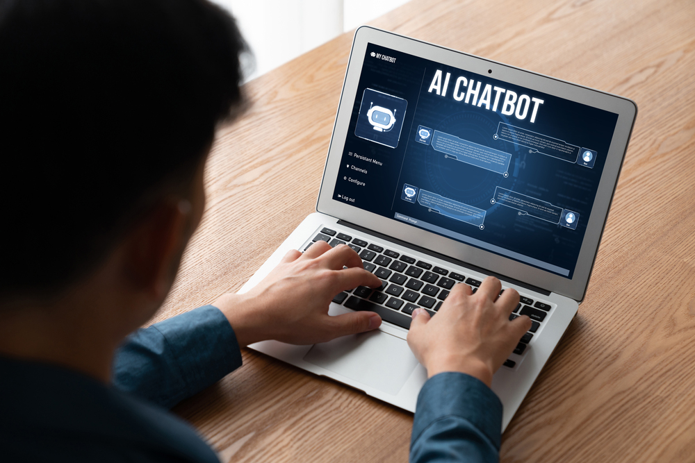Small business owner learning how to sell AI services without tech skills on a laptop in a modern office Small business owner learning how to sell AI services without tech skills on a laptop in a modern office