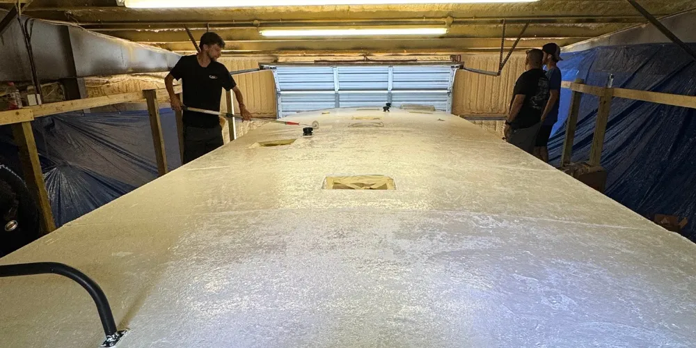 RV roof recoating in progress in Panama City FL to repair sun damage and extend waterproof protection RV roof recoating in progress in Panama City FL to repair sun damage and extend waterproof protection