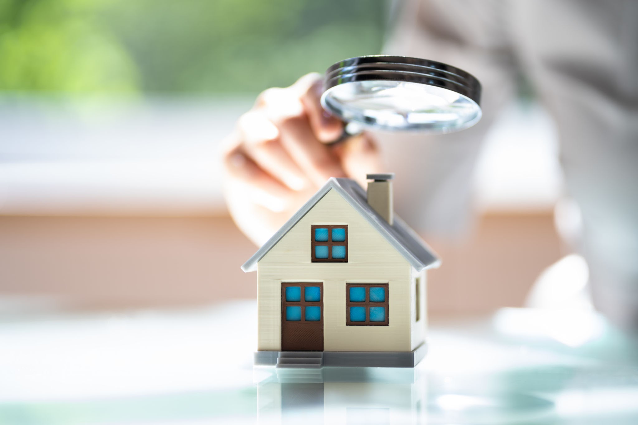 home under a magnifying glass home under a magnifying glass