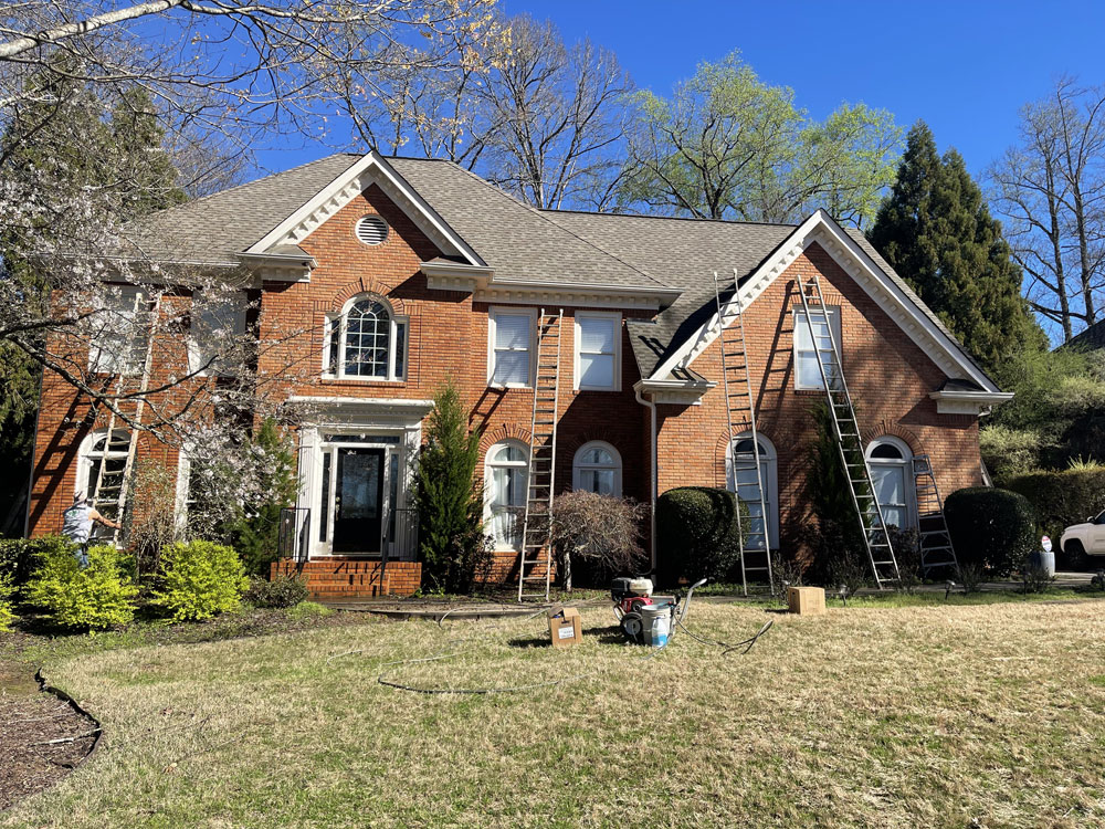 Pressure washing a Georgia home's exterior to remove pollen buildup Pressure washing a Georgia home's exterior to remove pollen buildup