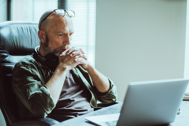 Middle-aged man deep in thought at laptop—reflecting on identity and discovering he’s on the autism spectrum, sparking the birth of the Ultimate Divergence theory. Middle-aged man deep in thought at laptop—reflecting on identity and discovering he’s on the autism spectrum, sparking the birth of the Ultimate Divergence theory.