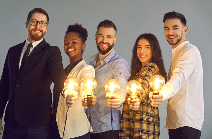 Diverse group of empowered professionals holding light bulbs—symbolizing collaborative insight and cognitive brilliance in an Ultimate Divergence mastermind community. Diverse group of empowered professionals holding light bulbs—symbolizing collaborative insight and cognitive brilliance in an Ultimate Divergence mastermind community.