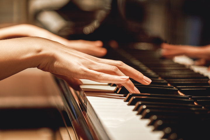 Close-up of hands playing piano keys, symbolizing how repeated neural patterns—like practiced music—can structurally reinforce divergent pathways in the brain over time. Close-up of hands playing piano keys, symbolizing how repeated neural patterns—like practiced music—can structurally reinforce divergent pathways in the brain over time.