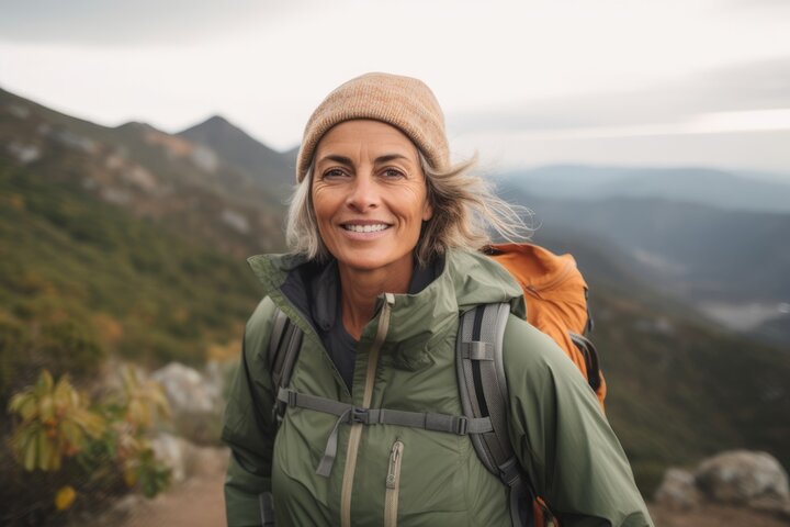 Smiling woman hiking in the mountains with a backpack, symbolizing independence and personal growth after completing the Ultimate Divergence course for autism healing. Smiling woman hiking in the mountains with a backpack, symbolizing independence and personal growth after completing the Ultimate Divergence course for autism healing.