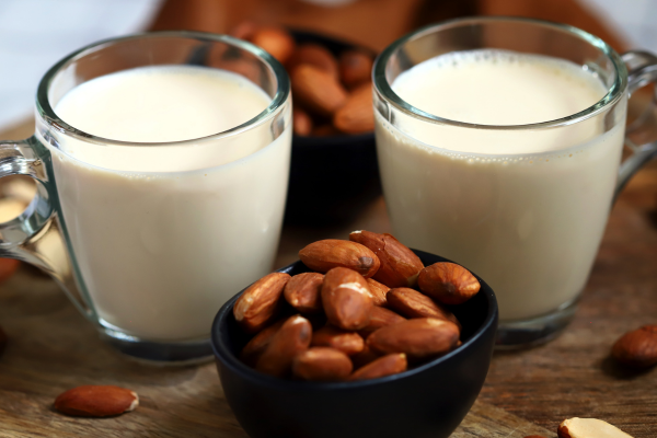 A glass of plain milk on a wooden table A glass of plain milk on a wooden table