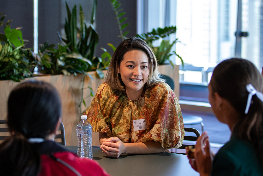 Riye Arai-Coupe talking to a group of girls during the Girls in Property Day event