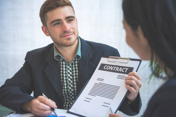 Insurance agent consulting a client, demonstrating communication skills and meeting client insurance needs