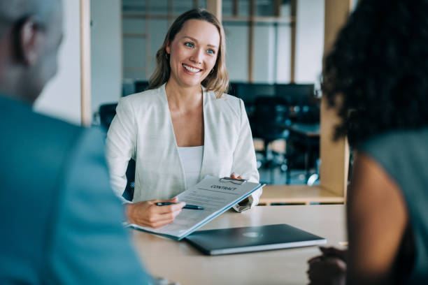 An entry-level insurance agent consulting a client.