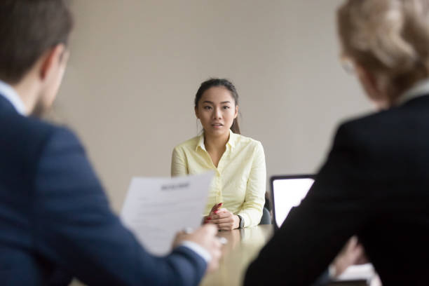 A job interview for an insurance agent, where the interviewee and interviewer are engaged in conversation.