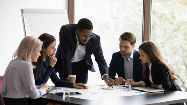 Diverse insurance professionals working together in an office.