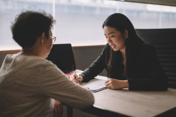 Insurance Agent consulting a client.