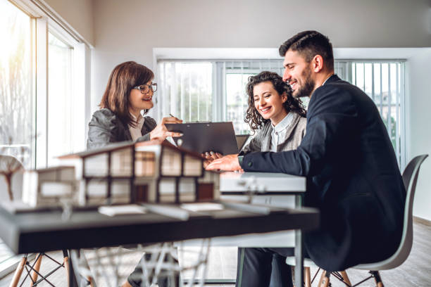 Image of happy agents enjoying the benefits of working together as a team at Elite Life Agency.