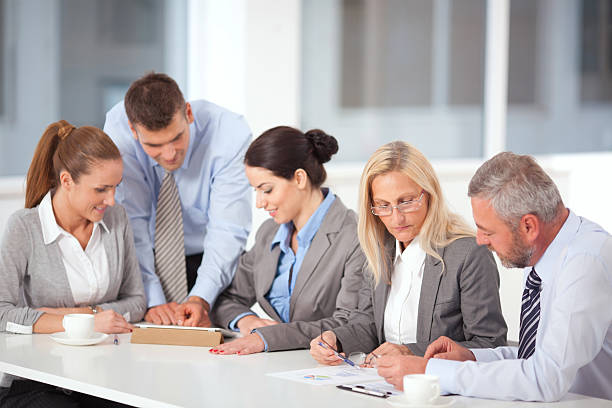 Business professionals participating in insurance-focused training activities.