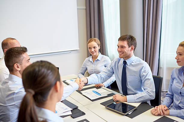 Life insurance agents in a meeting, discussing alternative industries.