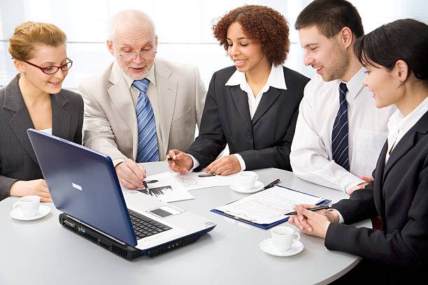 "A group of insurance agents discussing commissions