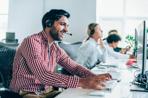 An insurance agent on the phone with a customer, offering great customer service and guidance.