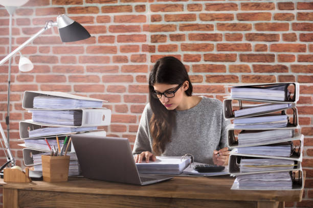  person doing paperwork to become licensed insurance agent