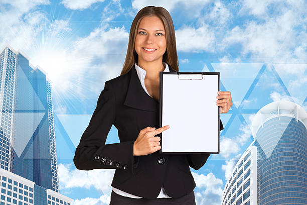 Image of a person in professional attire holding a clipboard, standing in front of an insurance emblem or logo. This image represents the requirements for an insurance agent job.