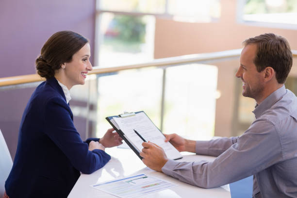 A friendly insurance agent working with a customer to find the right coverage