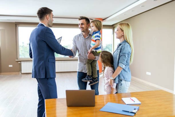 Insurance agent discussing insurance coverage options with a family.