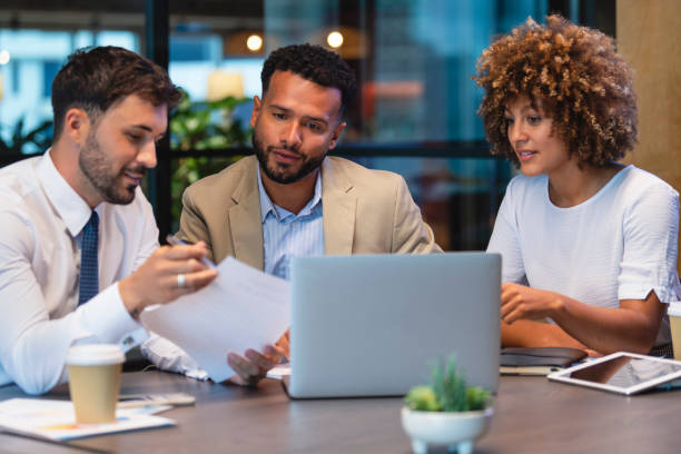 Diverse team of insurance agents in a collaborative setting.