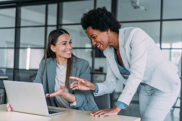 Insurance agent working with client in office - The Art of Crafting the Perfect Insurance Agent Resume"