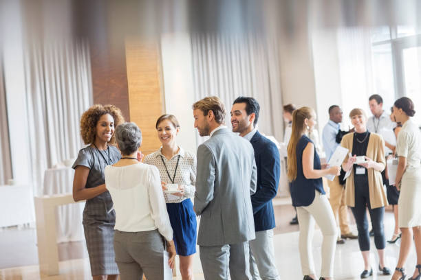 Insurance industry professionals networking at an event.