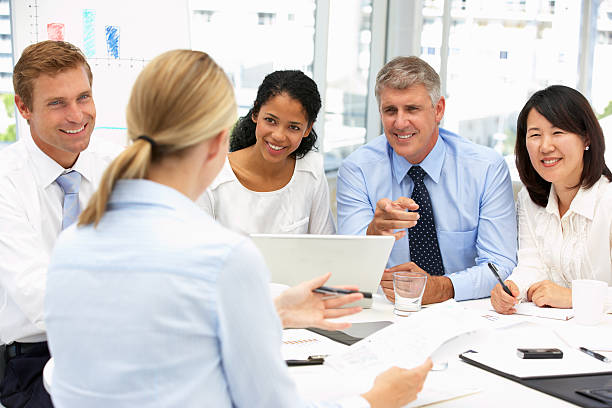  Diverse team of insurance brokers working together to meet their clients' needs.