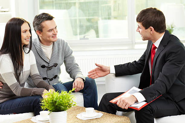 Health insurance agent discussing coverage with clients