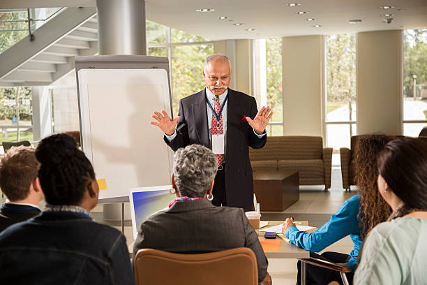 Male insurance agent presenting seminars to expanding his knowledge each year.