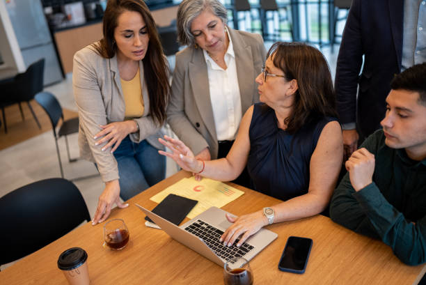 A diverse group of professionals collaborating in a modern office, representing the growth of health insurance agent demand in 2023