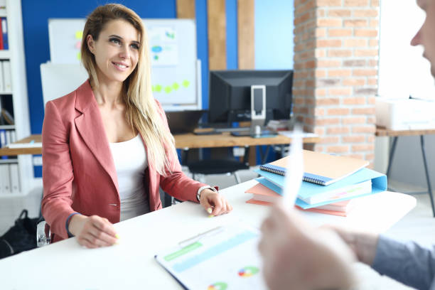 Professional insurance agent delivering a sales pitch to potential clients, showcasing expertise and trustworthiness.