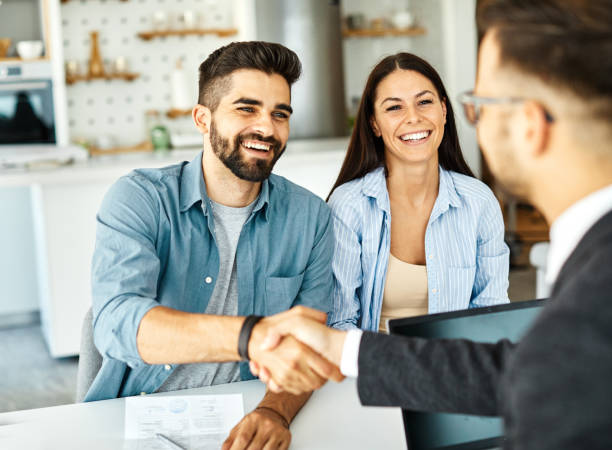 Elite Life Agency entry-level insurance agent with customer.