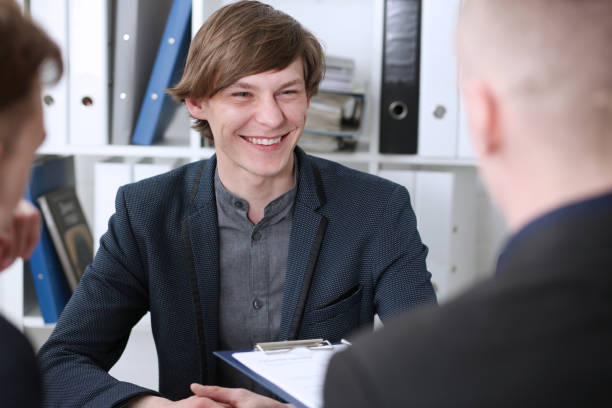 "Young insurance agent demonstrating emotional intelligence by empathetically communicating with a customer."