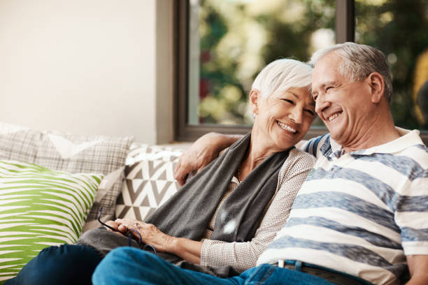 A happy couple enjoying their retirement after investing in a successful insurance portfolio.