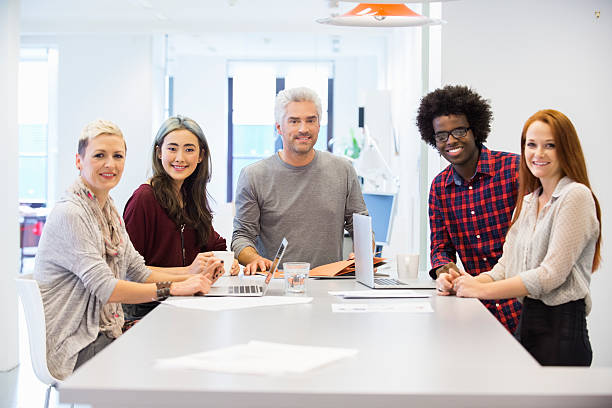 colorful image showcasing a group of diverse and smiling insurance agents working together in a modern office space.