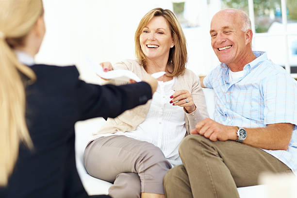 Image of an insurance agent assisting a happy client.