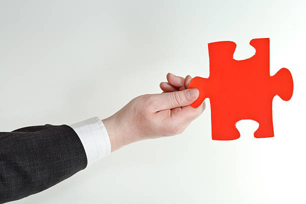 health insurance agent in the middle of jigsaw puzzle pieces