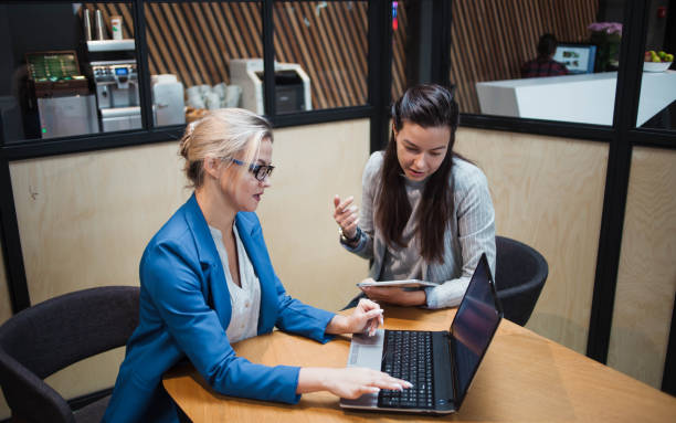 Smiling life and health insurance agents assisting customers online.