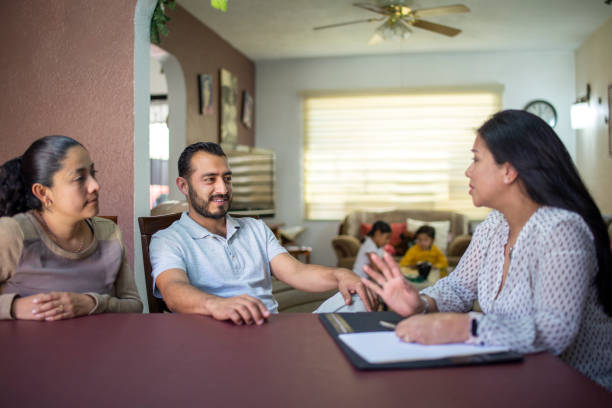 Happy ELA customers look relaxed wholesale discussing various Life Insurance policies.