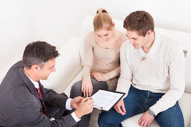 Part-time insurance agent with excellent people skills facilitating a potential sale.