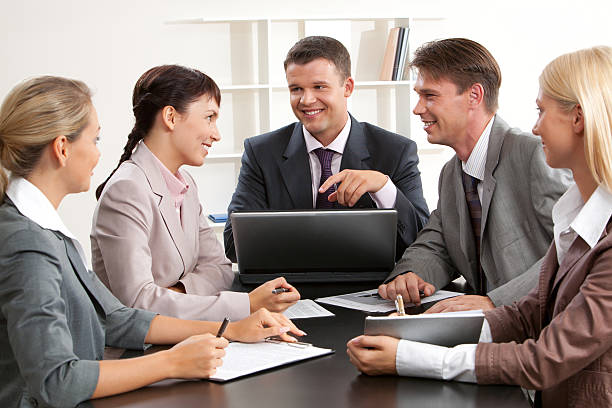 Underwriters discussing an insurance application