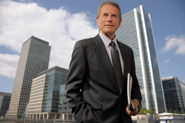 A professional insurance agent in a suit, confidently standing in front of a cityscape, symbolizing the rise of part-time insurance agents balancing work and personal life.