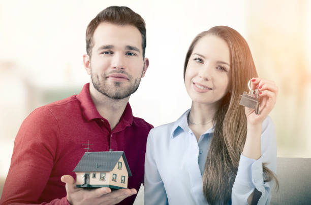 A part-time insurance agent celebrating the closing of a sale with satisfied customers and a small gift of appreciation.