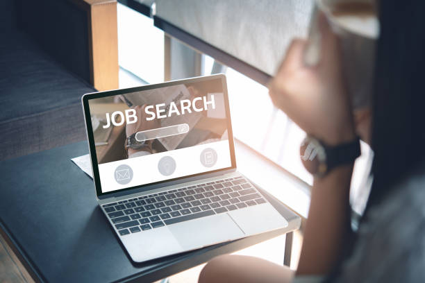  Image Alt Text: Image of person browsing online job listings for Health Insurance Agent positions
