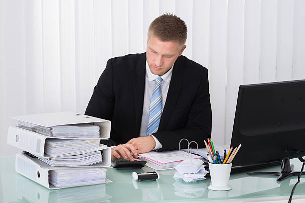 "Successful insurance agent assisting a satisfied client in an office setting. Trusted insurance solutions and rewards."