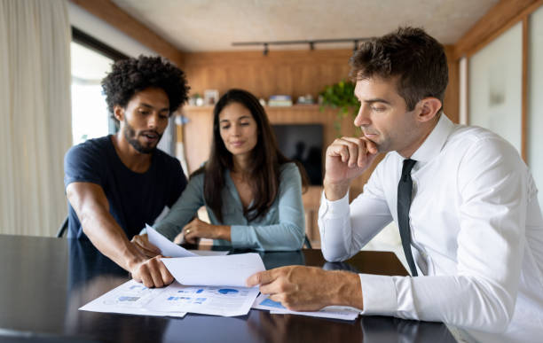  "Illustration of diverse insurance agents discussing commission structures in a professional setting."