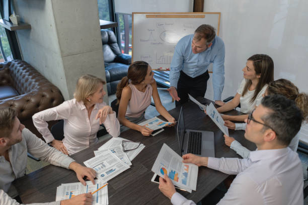 Insurance agent team discussing financial planning and client referral tactics